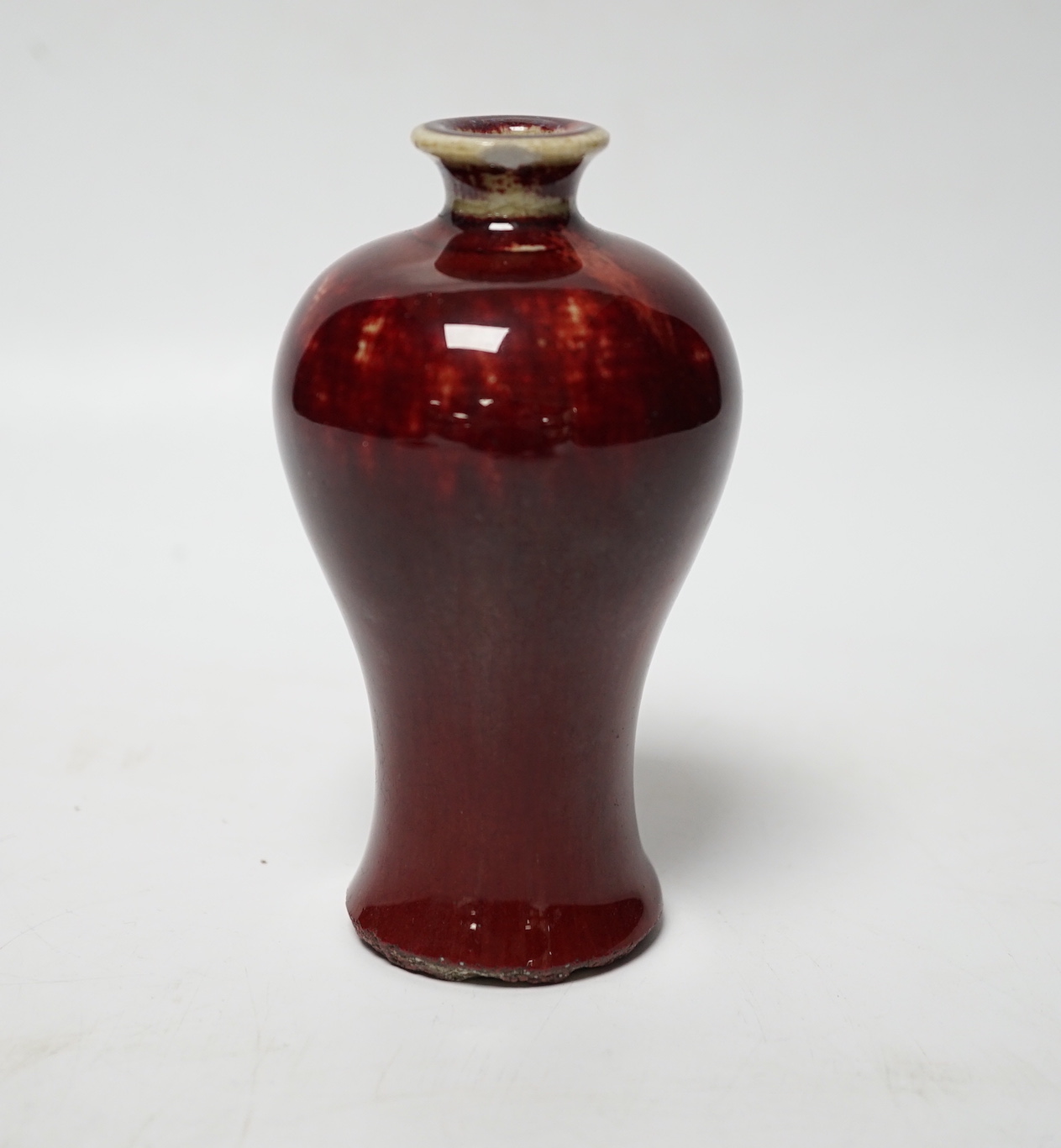 A small Chinese sang de boeuf meiping, 18th/19th century, 11cm high